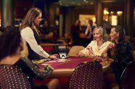 Live casino blackjack table with dealer and multi-camera interface